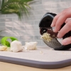 Stainless Steel Garlic Press Rocker Set of 4 Pieces, Premium Garlic Mincer, New Innovative Garlic Crusher with Peeler and Scraper, Comfortable Grip (Black)